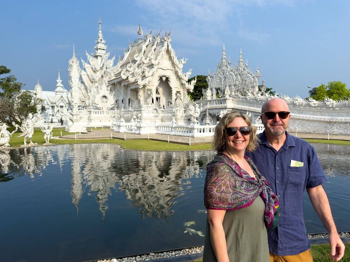 Mairin and Todd by the reflecting pond of the White Temple in Chiang Rai, Thailand