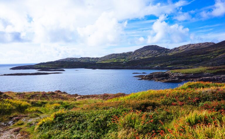 Rugged green coastline and a quiet bay on the Beara Peninsula in Ireland