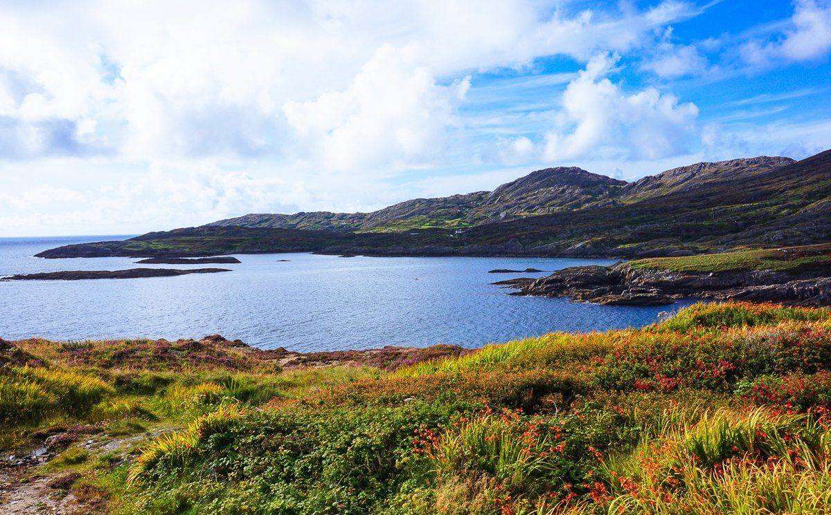 Rugged green coastline and a quiet bay on the Beara Peninsula in Ireland