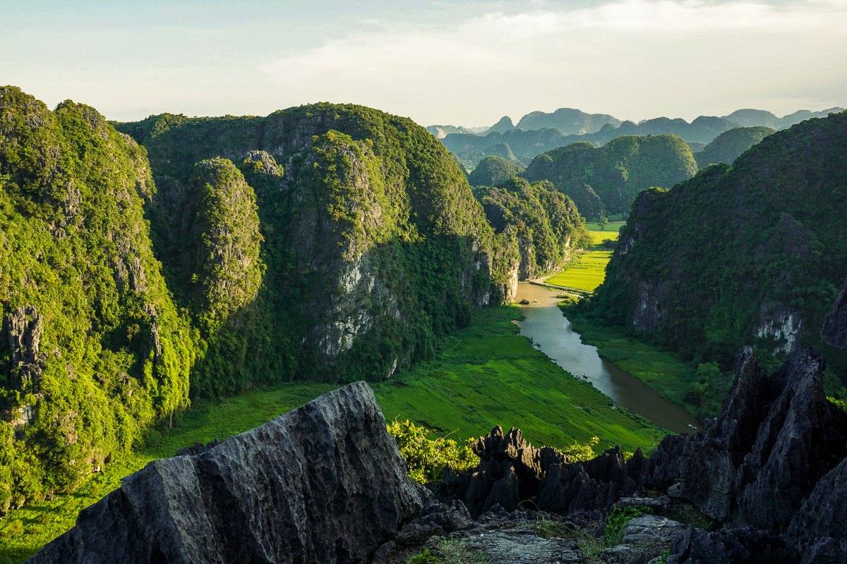 River winding through the karst mountains and rice paddies of Ninh Binh, Vietnam