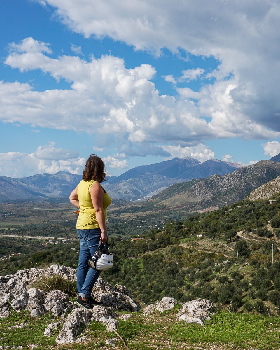 Mairin pausing to look out over a wide mountain valley on a back-road ride in Andalusia, Spain