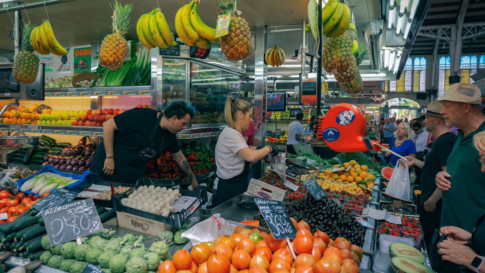 Fresh produce stalls at a Spanish indoor market