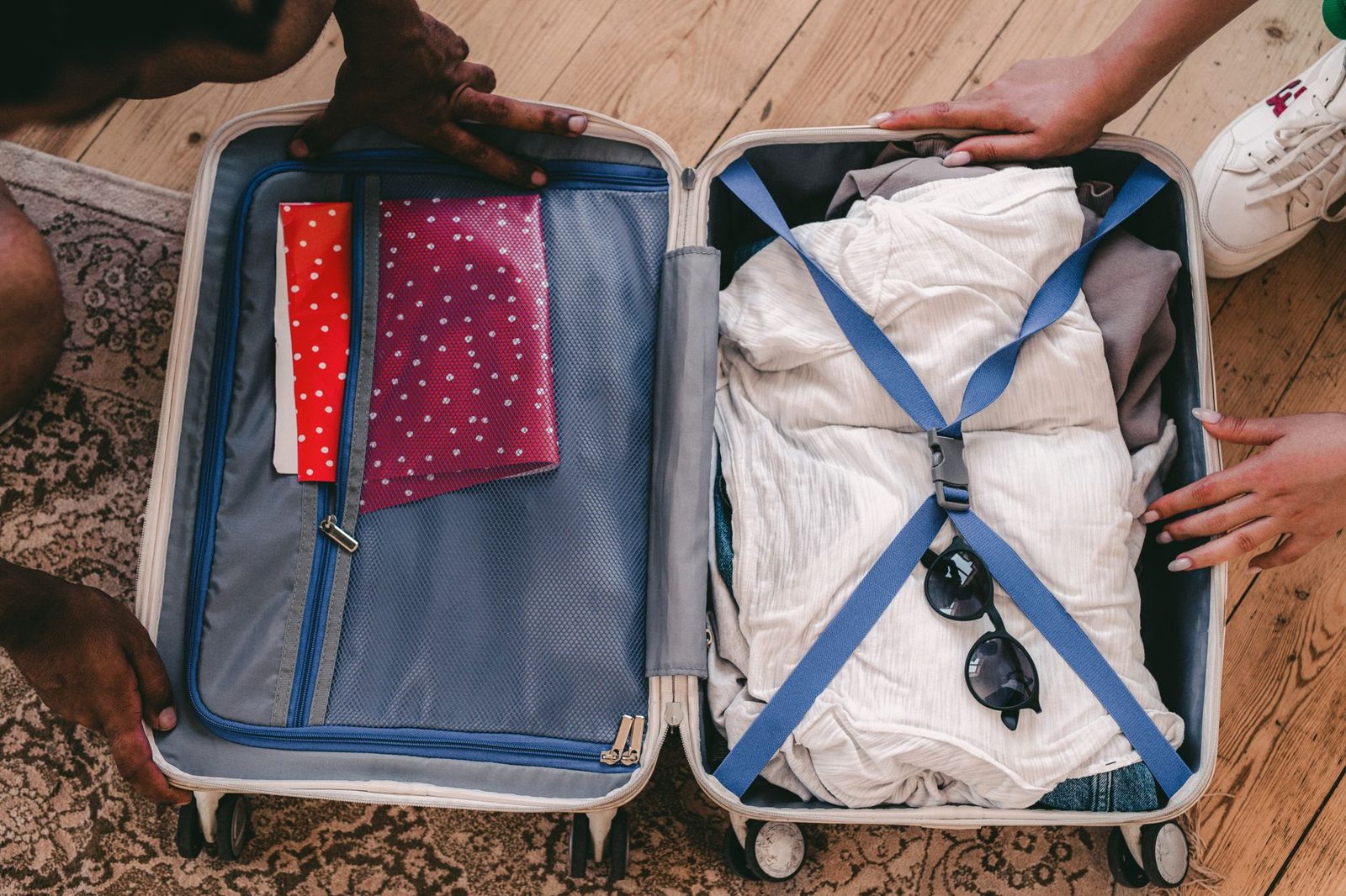 An open suitcase neatly packed for a trip